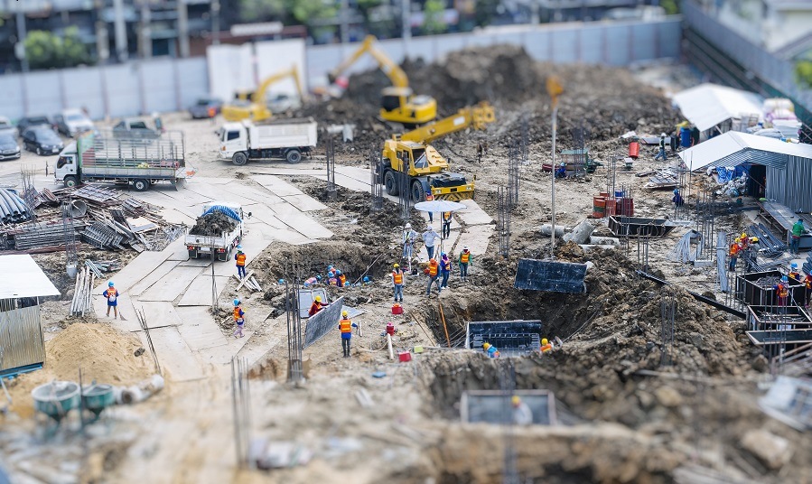 Construction site outdoor with Crane and People working